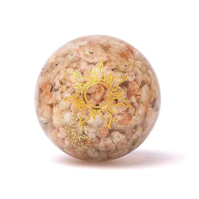 Orgonito sfera su Saulės akmeniu ir Saulės simboliu